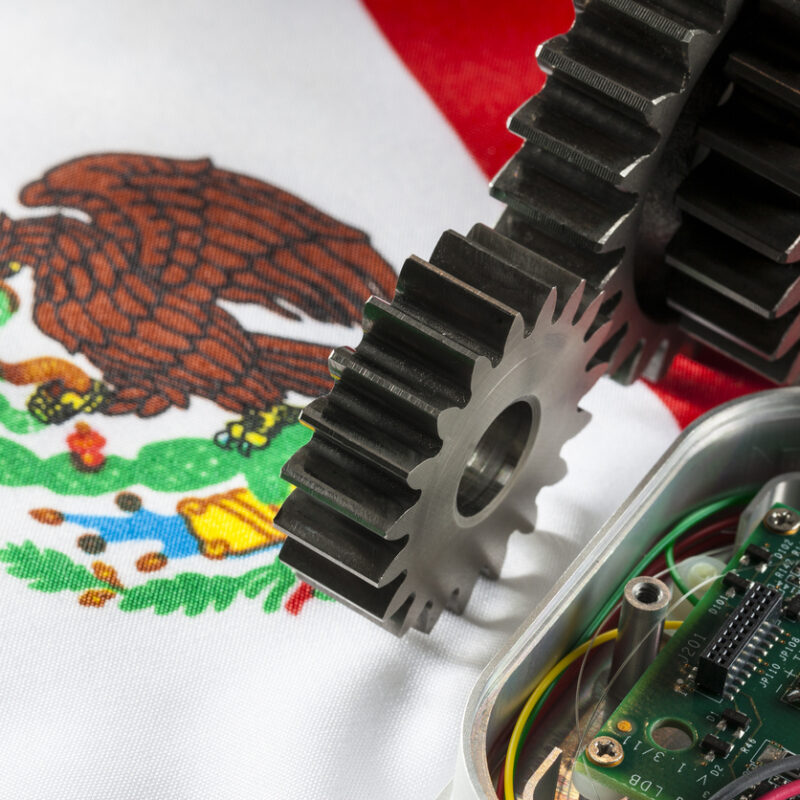 Mexican flag and gears. Concept for maquiladora. Or Engineering.
